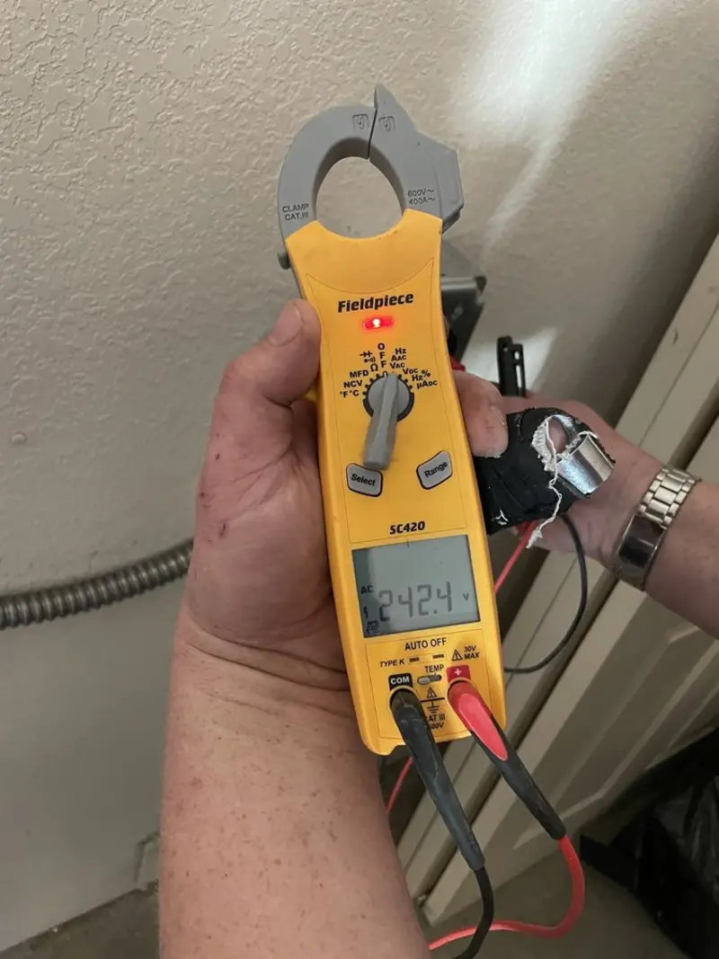 Voltage testing with clamp meter during Ceiling Fan Installation in Gardendale